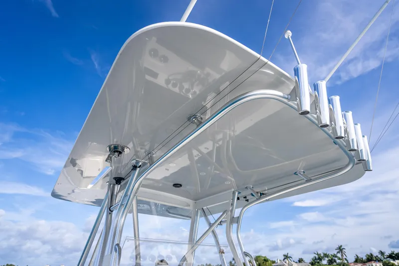 Slide: The Image of 2024 SeaVee 390B boat's sleek T-top against a clear blue sky. - 34