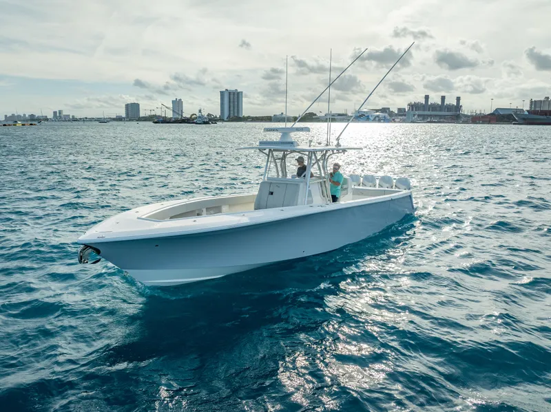 Slide: The Image of 2024 SeaVee 390B boat cruising on open water under a cloudy sky. - 36