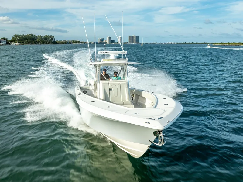 Slide: The Image of 2024 SeaVee 390B boat cruising on open water, showcasing sleek design and performance. - 38