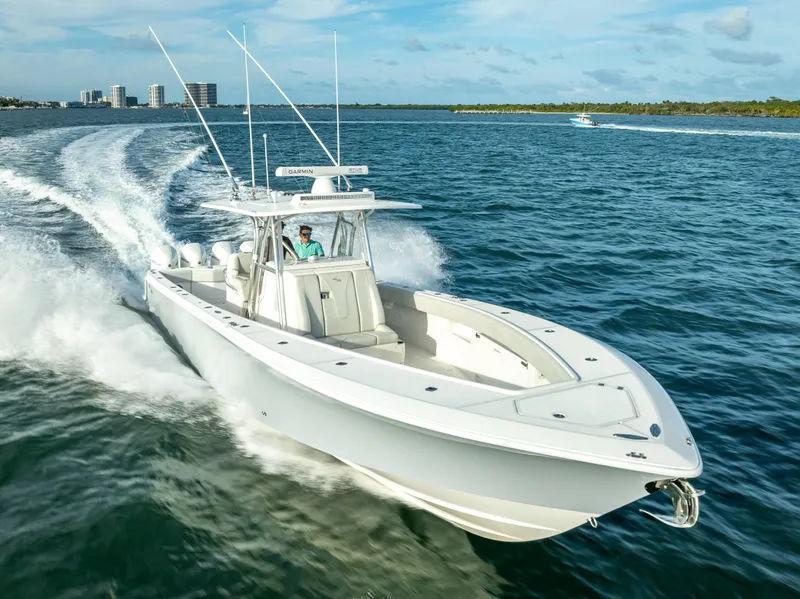 Slide: The Image of 2024 SeaVee 390B boat cruising on open water, showcasing sleek design and powerful performance. - 8