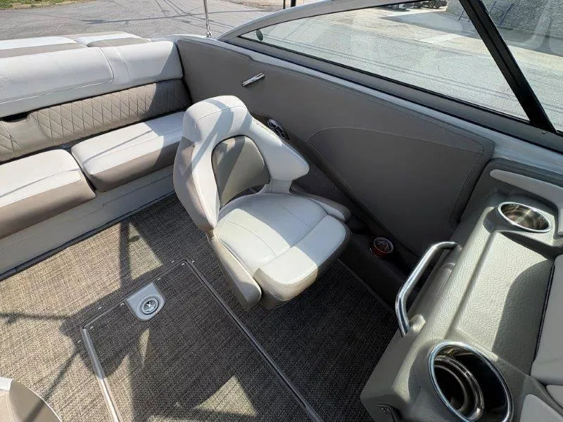 Slide: The Image of 2019 Crownline 215 SS boat interior with gray seating and carpeted floor. - 31