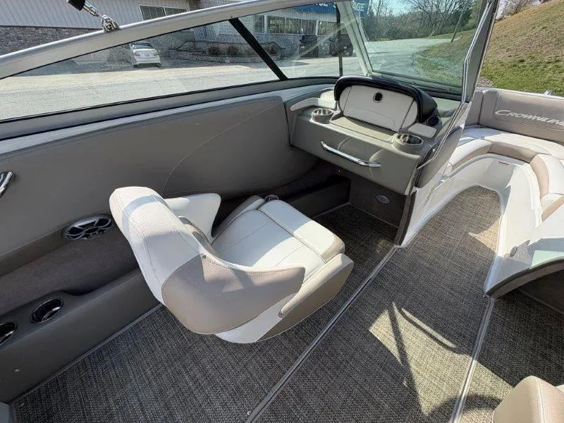 Slide: The Image of 2019 Crownline 215 SS boat interior with plush seating and modern design. - 38