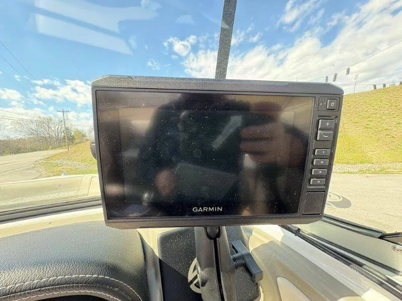 Slide: The Image of Garmin GPS device mounted on a 2019 Crownline 215 SS boat dashboard. - 48