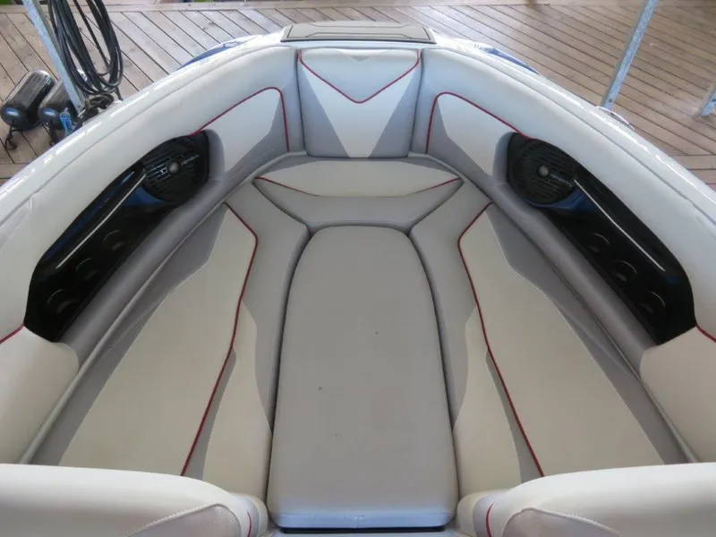 Slide: The Image of 2017 Centurion Ri237 boat interior with cushioned seating and built-in speakers. - 11