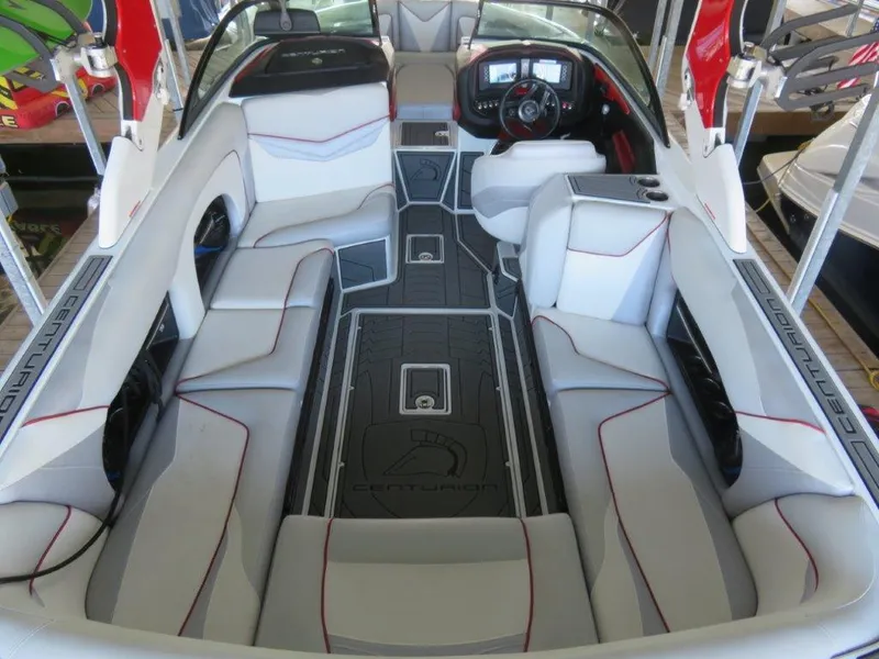 Slide: The Image of 2017 Centurion Ri237 boat interior with sleek seating and modern dashboard design. - 5