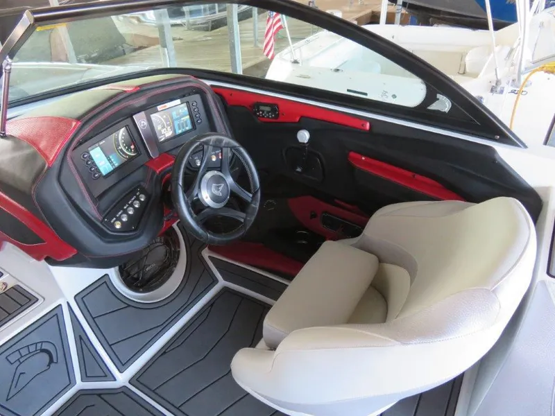 Slide: The Image of 2017 Centurion Ri237 boat interior with modern dashboard and comfortable seating. - 7