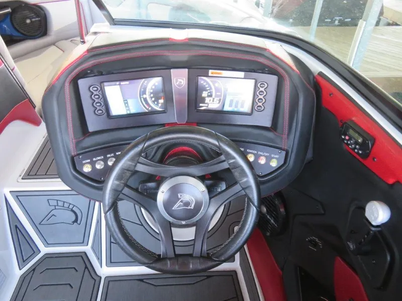 Slide: The Image of 2017 Centurion Ri237 boat dashboard with dual displays and steering wheel. - 8