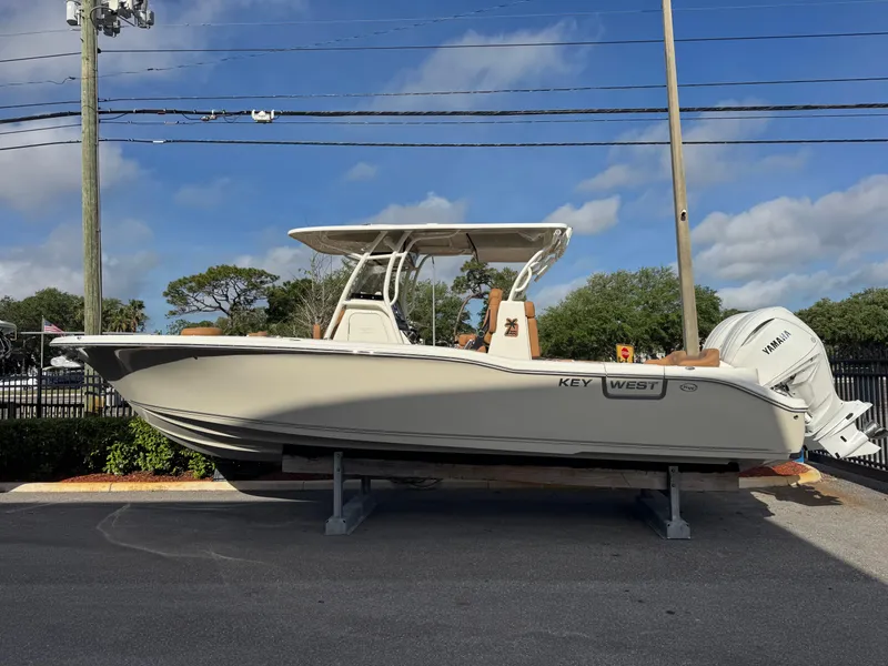 Slide: The Image of 2025 Key West 291 FS boat on display, side view, outdoors. - 1
