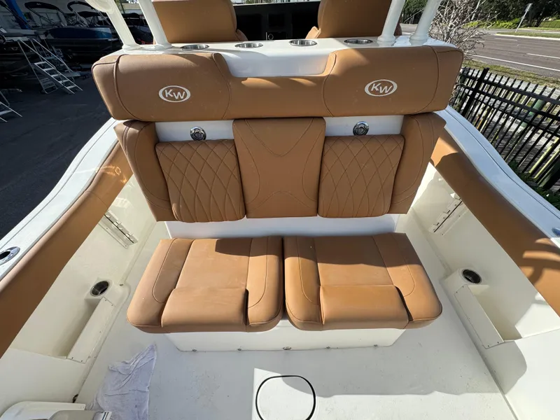 Slide: The Image of 2025 Key West 291 FS boat with tan leather seating and KW logo. - 15