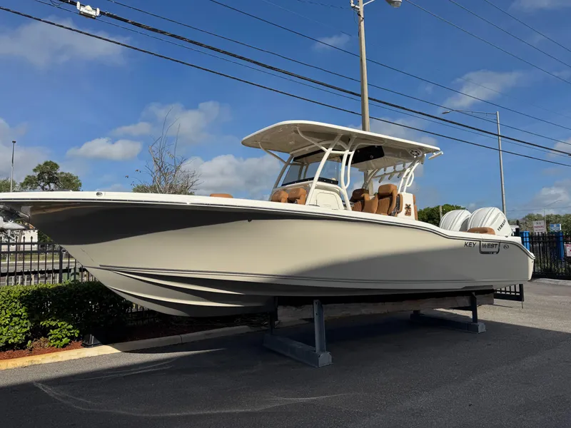 Slide: The Image of 2025 Key West 291 FS boat displayed outdoors on a sunny day. - 2