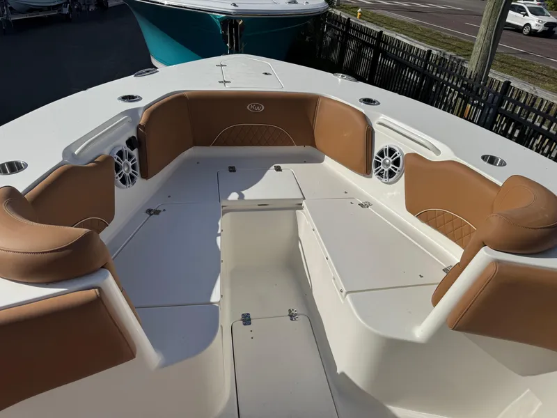 Slide: The Image of 2025 Key West 291 FS boat interior with tan seating and white deck. - 25
