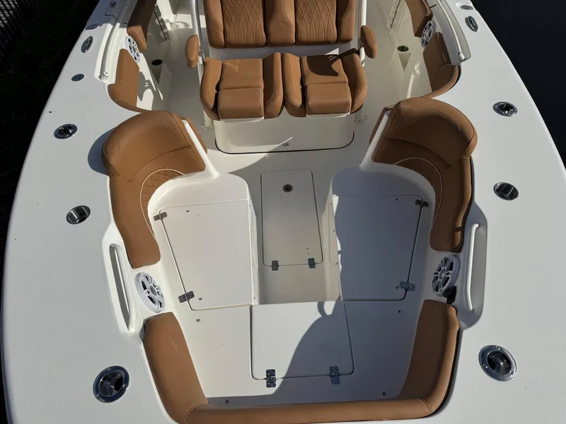 Slide: The Image of 2025 Key West 291 FS boat interior with tan seating and white deck. - 26
