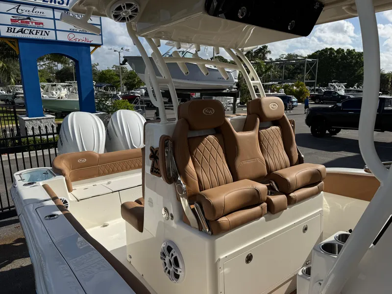 Slide: The Image of 2025 Key West 291 FS boat with luxurious tan seating and modern design. - 31