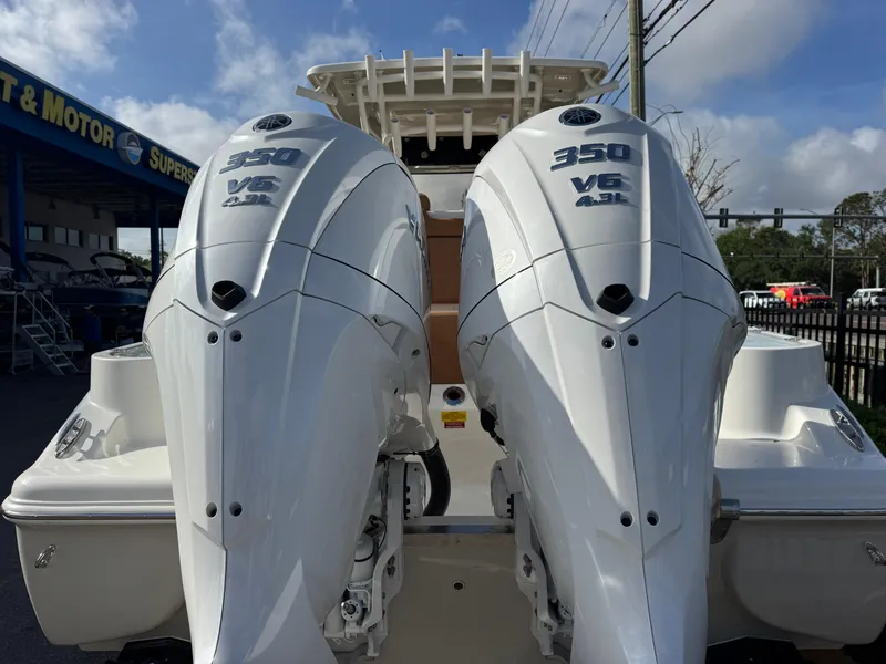 Slide: The Image of 2025 Key West 291 FS boat with dual 350 V6 engines, rear view. - 7