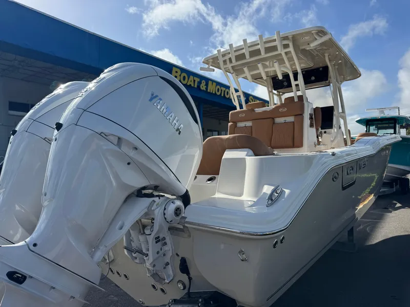 Slide: The Image of 2025 Key West 291 FS boat with Yamaha engines at a dealership. - 8