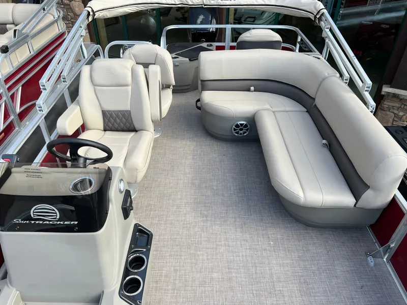 Slide: The Image of 2025 Sun Tracker Bass Buggy 16 XL Select pontoon boat interior with plush seating. - 4