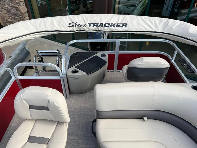 Slide: The Image of 2025 Sun Tracker Bass Buggy 16 XL Select pontoon boat interior with seating and console. - 5
