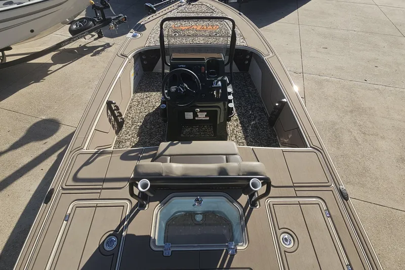 Slide: The Image of 2025 Mako 18 Pro Skiff Backwater Edition boat, featuring a sleek interior and modern design. - 7