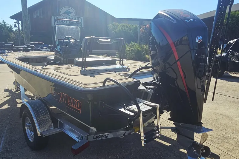 Slide: The Image of 2025 Mako 18 Pro Skiff Backwater Edition boat with powerful outboard motor. - 4