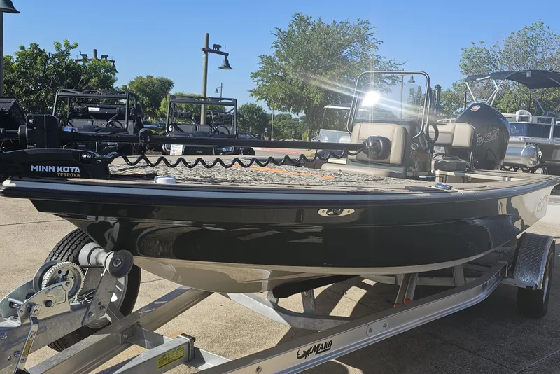 Slide: The Image of 2025 Mako 18 Pro Skiff Backwater Edition boat on trailer, featuring Minn Kota Terrova motor. - 6