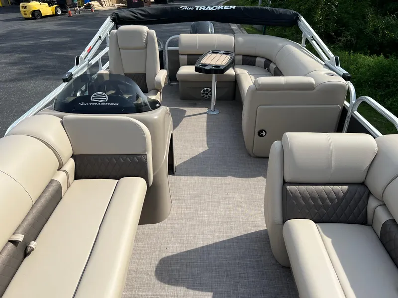 Slide: The Image of 2025 Sun Tracker Party Barge 20 DLX with spacious seating and modern design. - 2