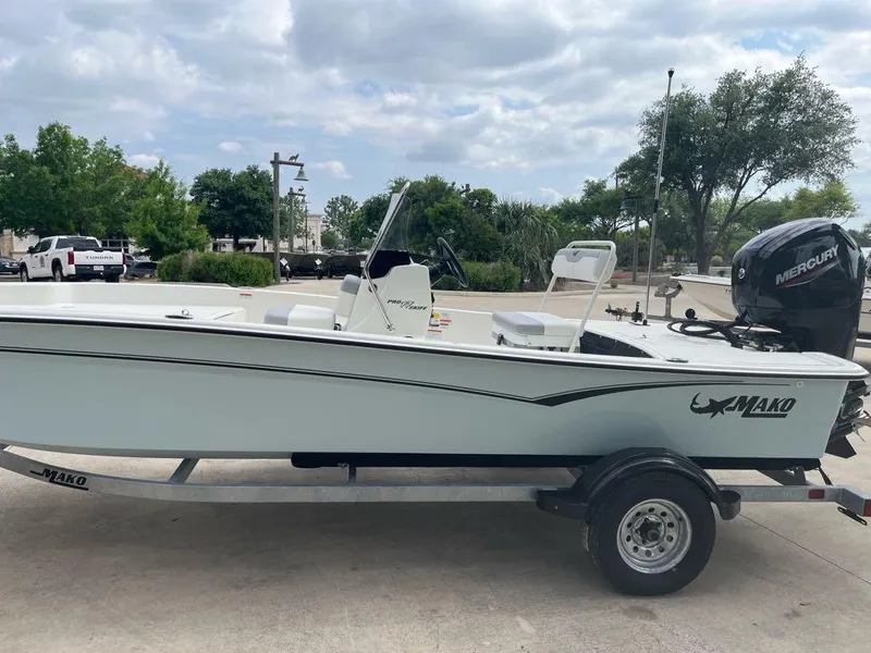 Slide: The Image of 2025 Mako Pro Skiff 17 CC boat on trailer, parked outdoors. - 3