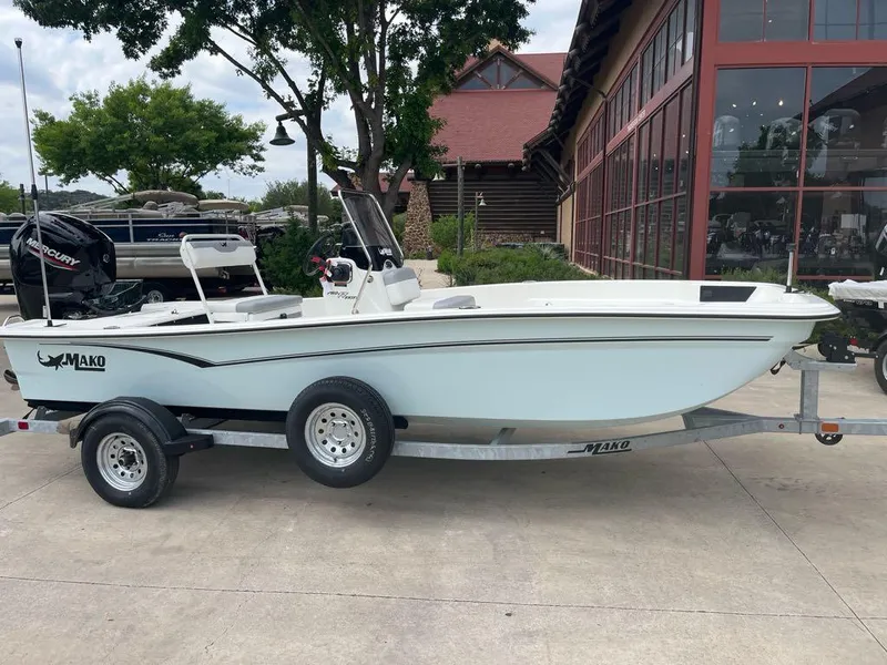 Slide: The Image of 2025 Mako Pro Skiff 17 CC boat on trailer, parked outdoors. - 5