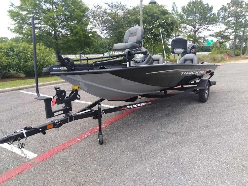 Slide: The Image of 2025 Tracker Pro Team 190 fishing boat on trailer in parking lot. - 2