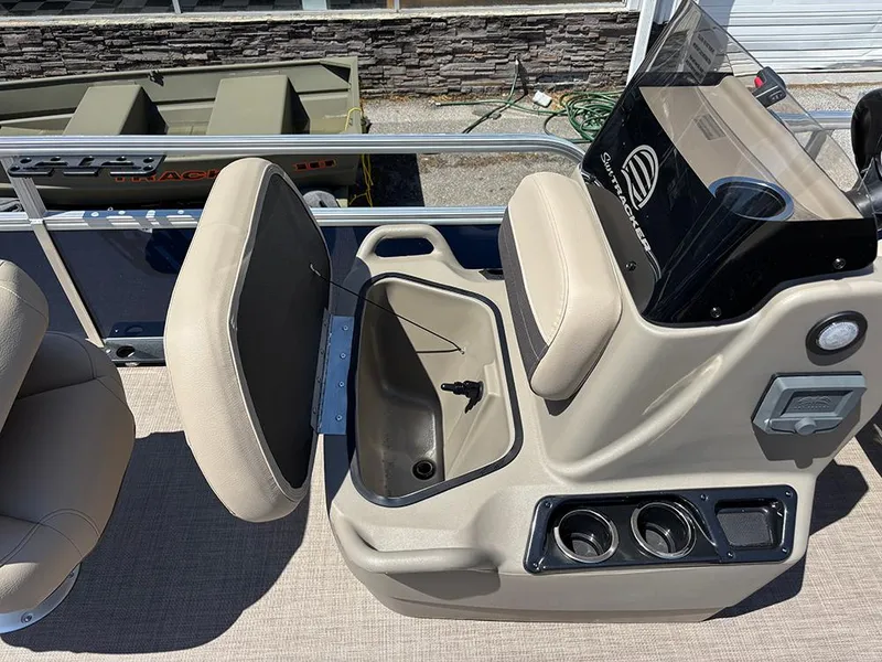 Slide: The Image of 2025 Sun Tracker Bass Buggy 16 XL Select boat interior with seating and console details. - 13