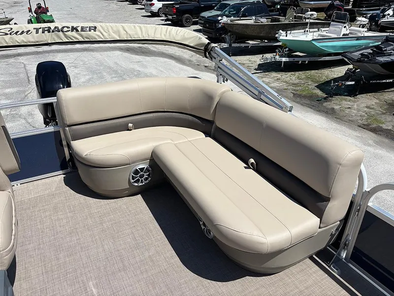 Slide: The Image of 2025 Sun Tracker Bass Buggy 16 XL Select pontoon boat with beige seating. - 14
