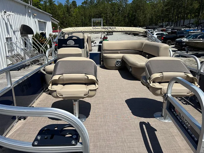 Slide: The Image of 2025 Sun Tracker Bass Buggy 16 XL Select pontoon boat with spacious seating and modern design. - 9
