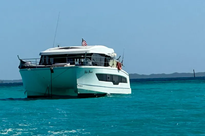 Slide: The Image of 2021 Fountaine Pajot MY4.S yacht cruising on turquoise waters. - 1