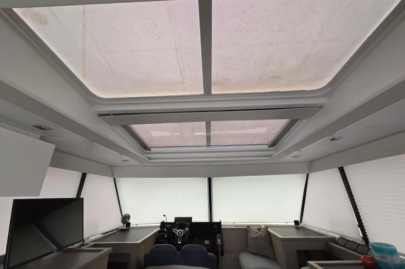 Slide: The Image of Interior of 2021 Fountaine Pajot MY4.S yacht with modern seating and helm. - 10