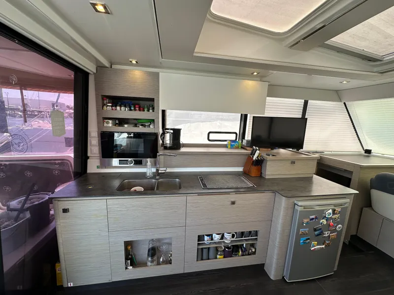 Slide: The Image of Interior of 2021 Fountaine Pajot MY4.S yacht with panoramic windows and modern design. - 12