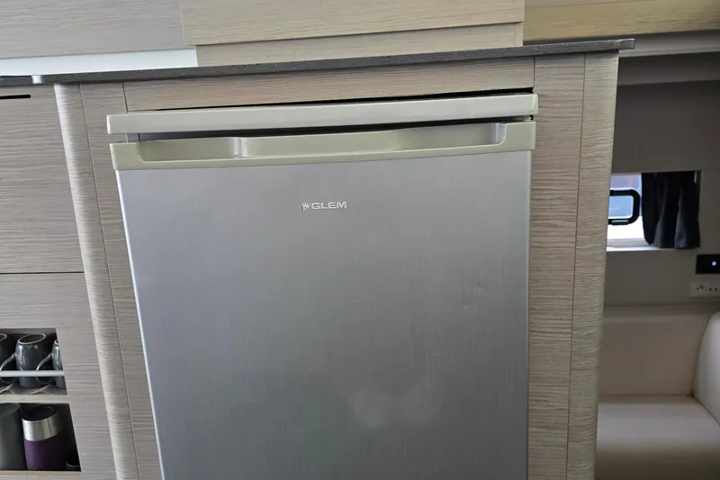 Slide: The Image of Luxurious interior of 2021 Fountaine Pajot MY4.S yacht with modern kitchen and seating area. - 14