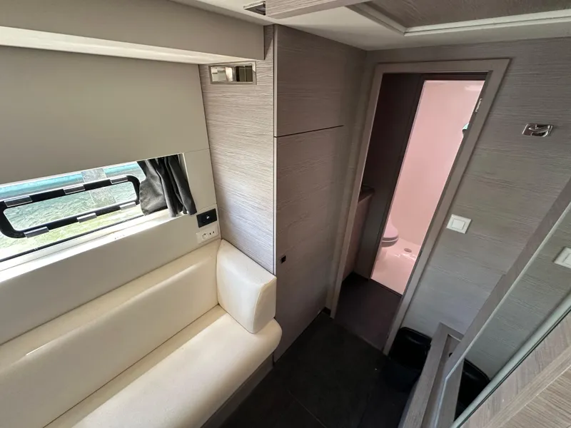 Slide: The Image of Interior of 2021 Fountaine Pajot MY4.S yacht with compact fridge and control panel. - 19