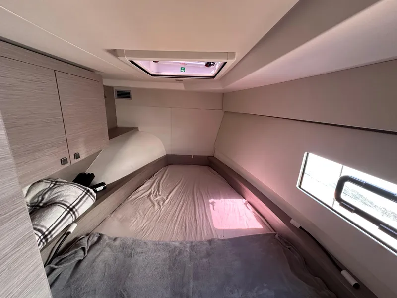 Slide: The Image of Interior of 2021 Fountaine Pajot MY4.S yacht with white seating and a hat. - 23