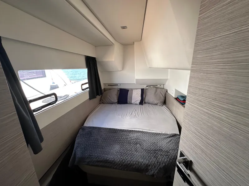 Slide: The Image of Interior of 2021 Fountaine Pajot MY4.S yacht, featuring modern seating and bathroom. - 25