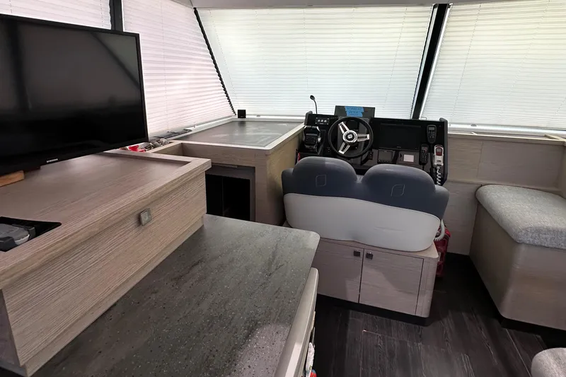 Slide: The Image of Modern interior of 2021 Fountaine Pajot MY4.S yacht with sleek kitchen and seating area. - 4