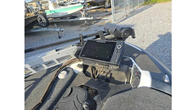 Slide: The Image of 2022 Skeeter ZXR20 boat dashboard with navigation system and controls. - 10