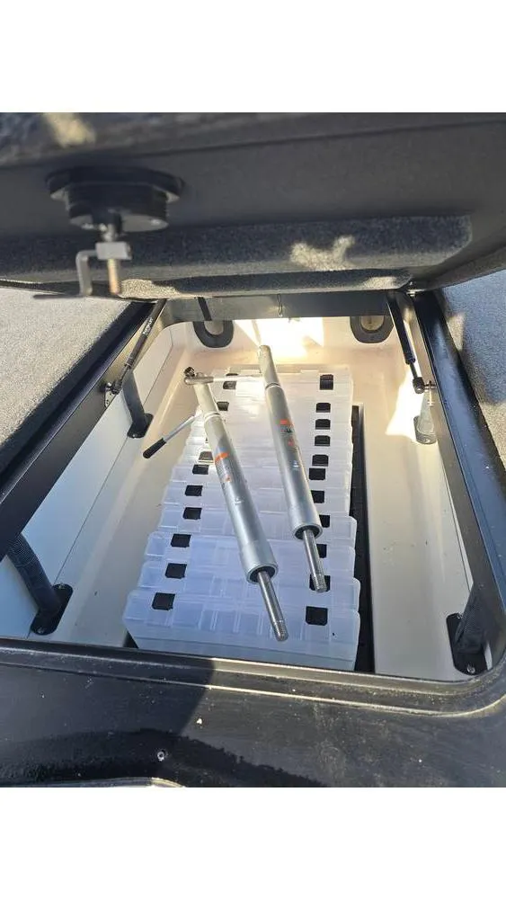 Slide: The Image of Storage compartment of 2022 Skeeter ZXR20 boat with hydraulic struts. - 12