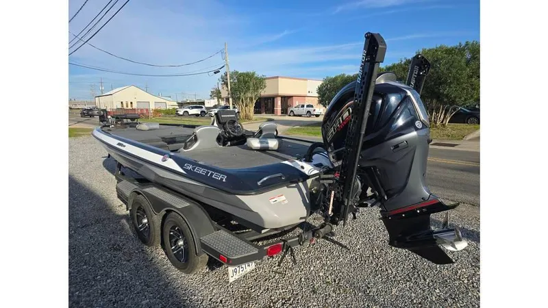 Slide: The Image of 2022 Skeeter ZXR20 boat with powerful outboard motor on a trailer. - 5
