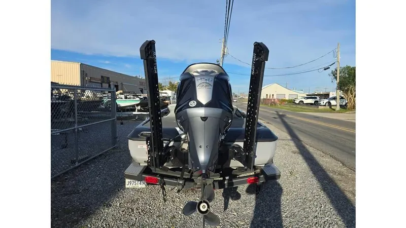 Slide: The Image of 2022 Skeeter ZXR20 boat rear view with dual power poles on a trailer. - 6