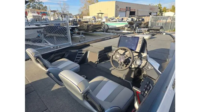 Slide: The Image of 2022 Skeeter ZXR20 boat interior with steering console and seating. - 8
