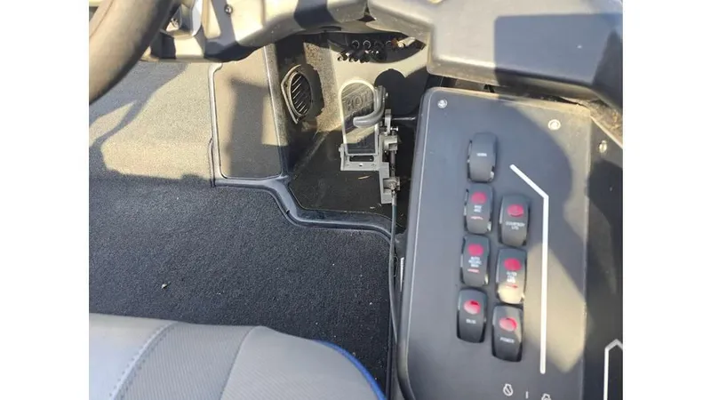 Slide: The Image of Control panel of 2022 Skeeter ZXR20 boat with switches and steering wheel. - 9