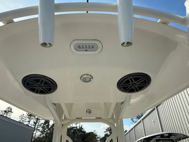 Slide: The Image of 2022 Pathfinder 2500 Hybrid boat T-top with speakers and lights, viewed from below. - 17