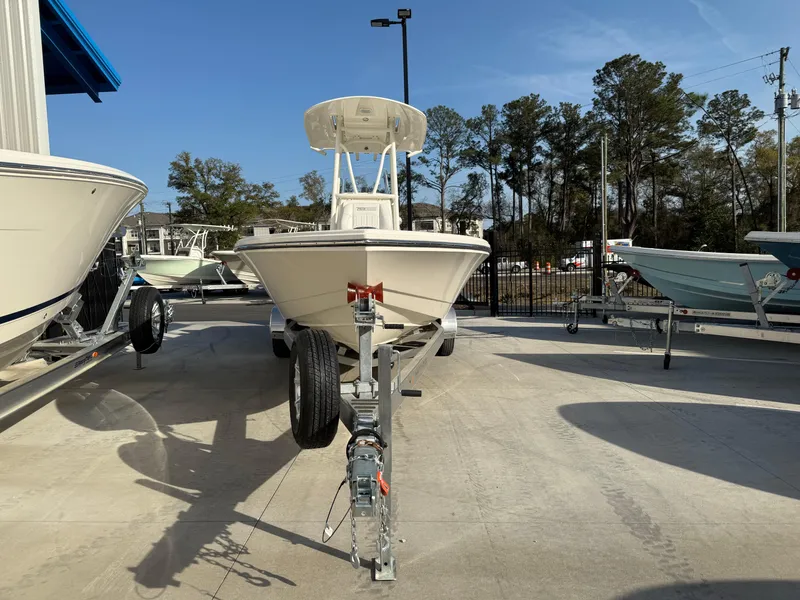Slide: The Image of 2022 Pathfinder 2500 Hybrid boat on trailer in outdoor showroom. - 3