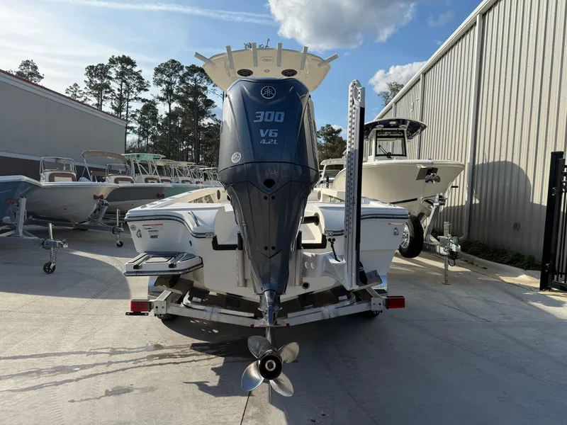 Slide: The Image of 2022 Pathfinder 2500 Hybrid boat with Yamaha 300 V6 engine, parked outdoors. - 4