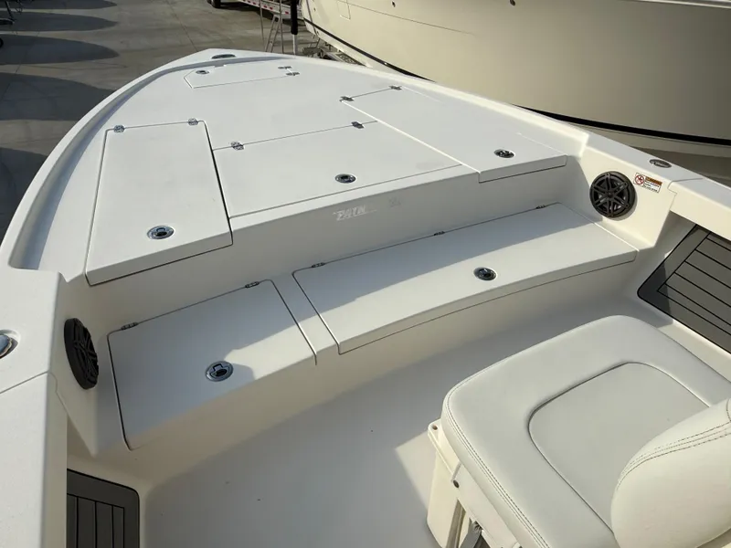 Slide: The Image of 2022 Pathfinder 2500 Hybrid boat interior with seating and storage compartments. - 5