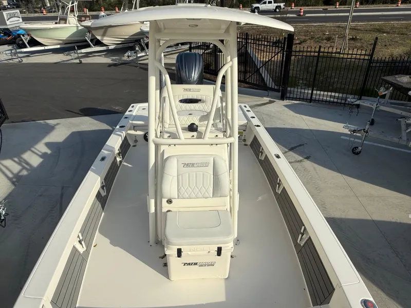 Slide: The Image of 2022 Pathfinder 2500 Hybrid boat, center console, white exterior, docked outdoors. - 9